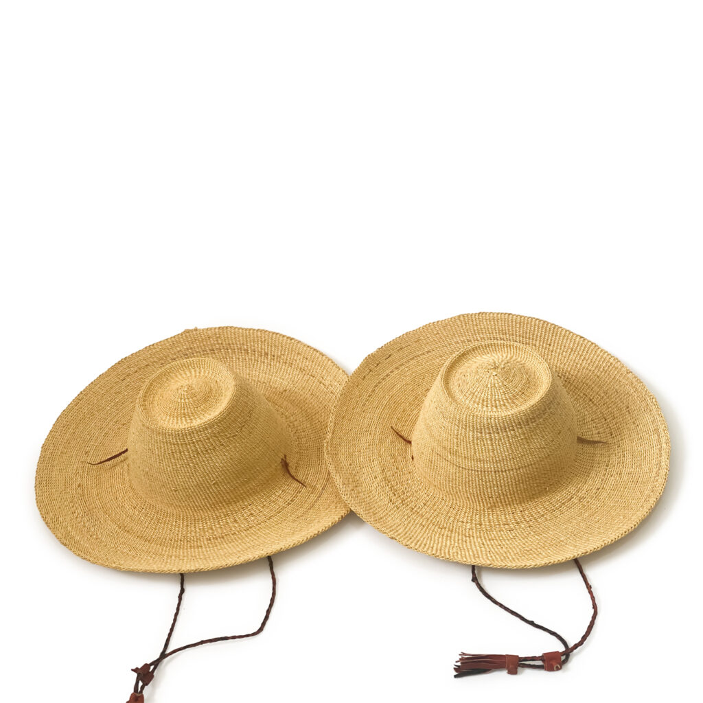 a pair of african straw hats for men and women