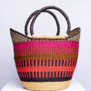 a colorful bolga shopper basket with handles