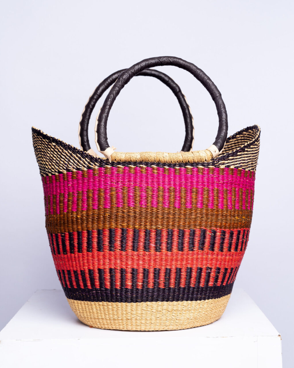 a colorful bolga shopper basket with handles