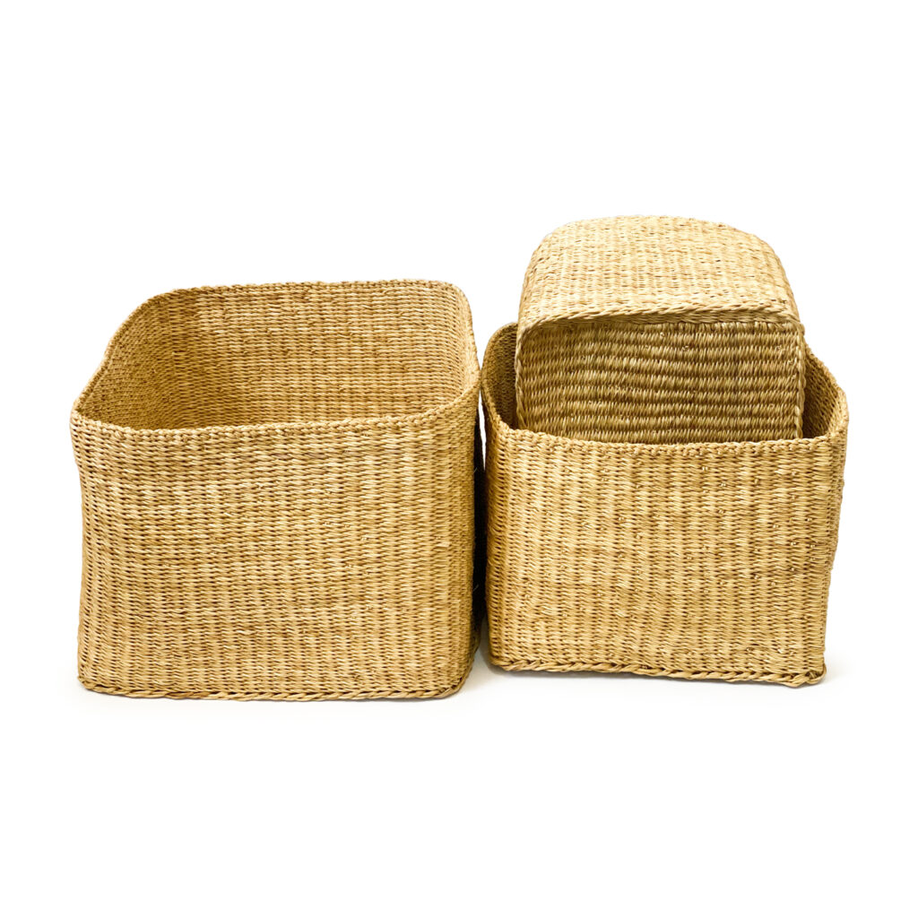 three rectangular woven baskets on a white background