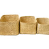 three rectangular woven baskets on a white background