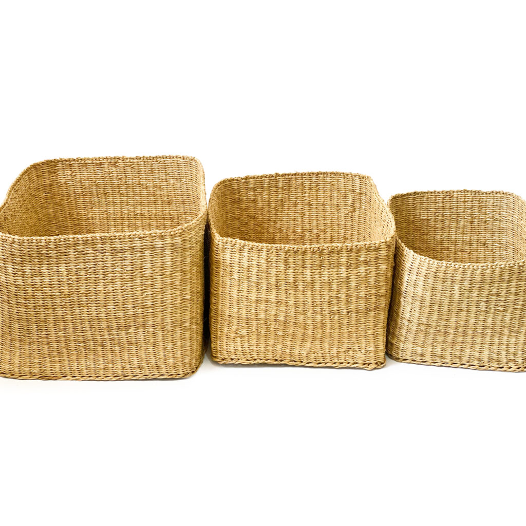 three rectangular woven baskets on a white background