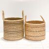 two woven laundry baskets with handles