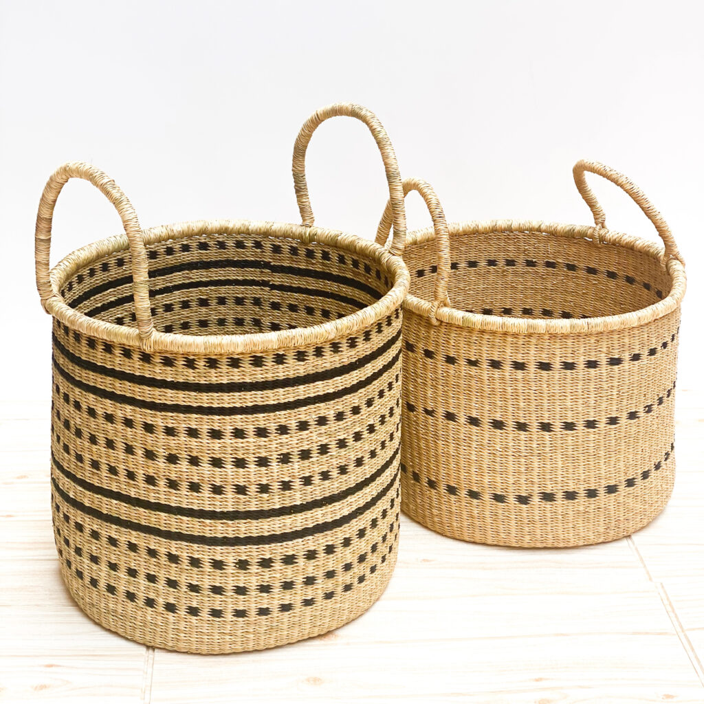 two woven laundry baskets with handles