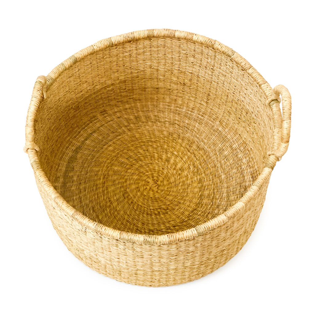 a woven plant basket with handles