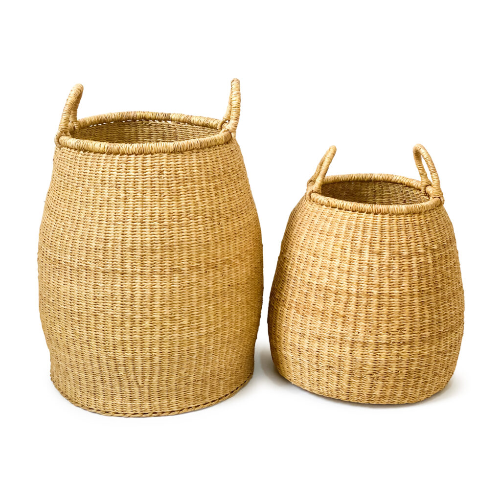 two woven plant baskets with handles on a white background