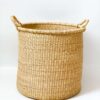 large woven laundry basket with handles