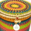 large colorful woven laundry basket with lid and handles