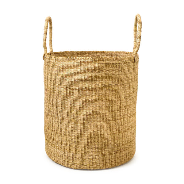 a woven laundry basket with handles on a white background