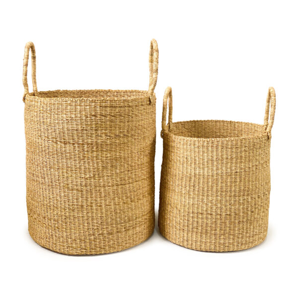 two woven laundry baskets with handles on them