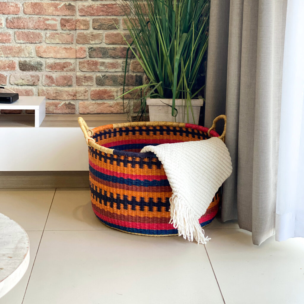 a colorful woven floor basket